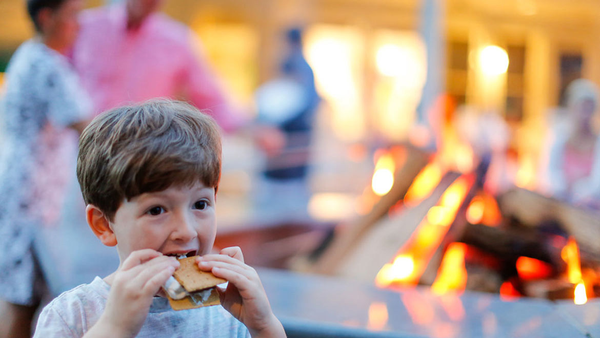 kid eating smores