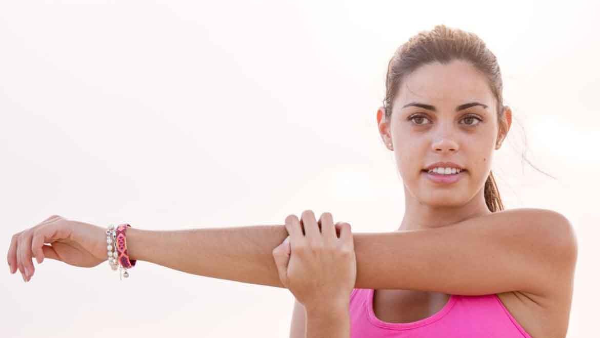 Woman stretching her shoulder