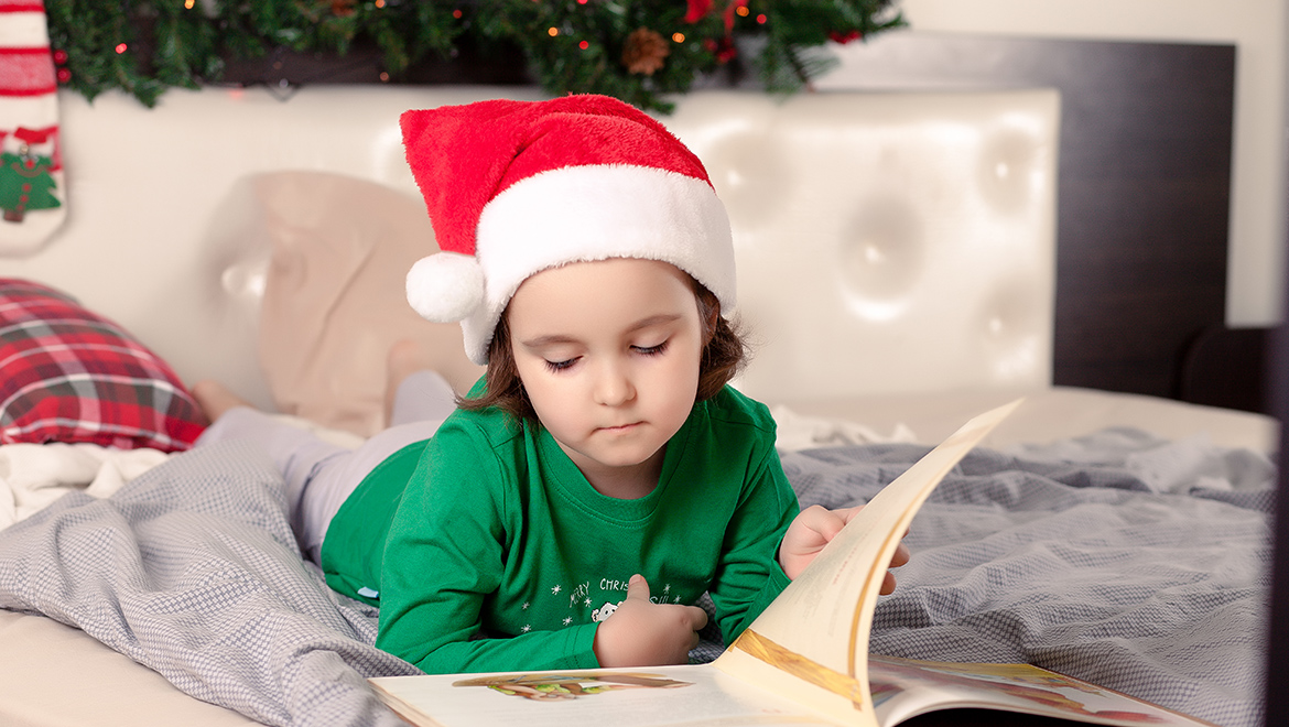 Little girl wearing an elf hat