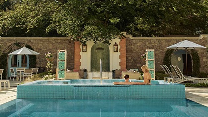 Couple lounging at the spa pool 