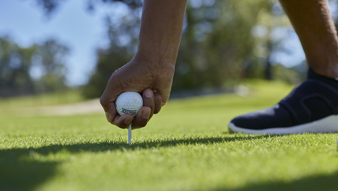 Guy holding golf ball