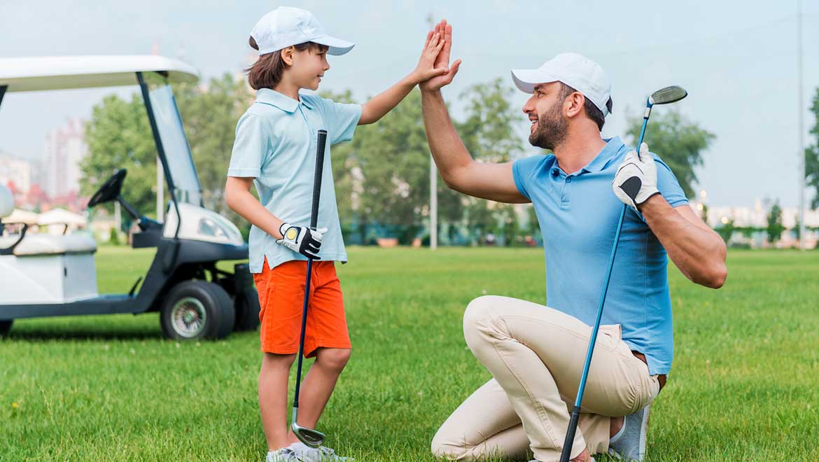 Father and son golfing