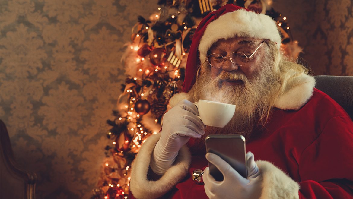 Santa drinking hot beverage