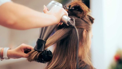 Woman getting her hair done at a salon