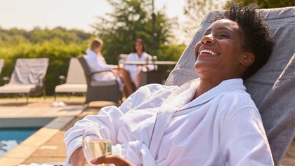 Woman relaxing by the pool