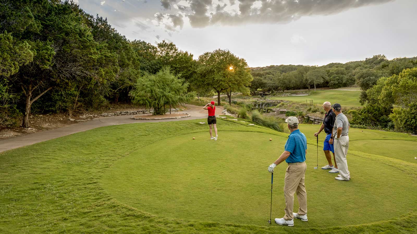 Group teeing off.