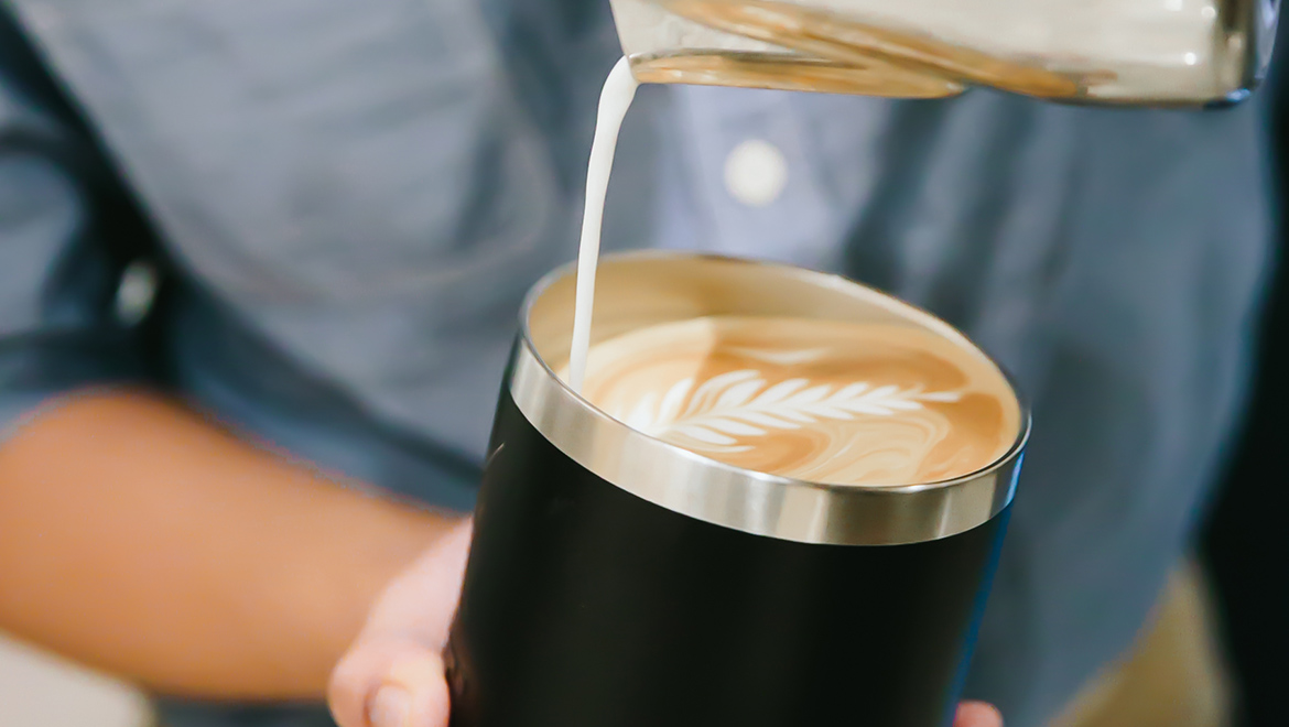 Barista pouring coffee