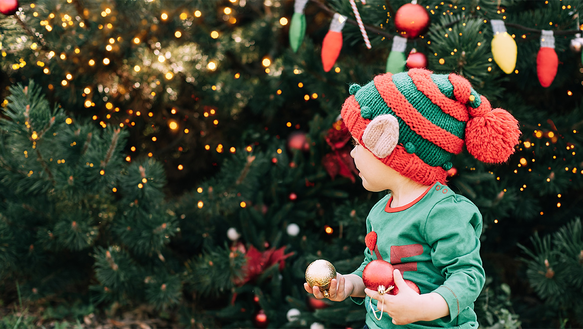 Child dressed as Christmas elf