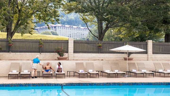 Couple lounging by the pool