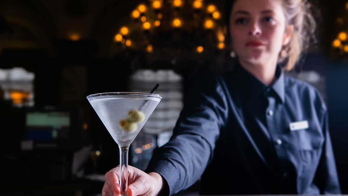 Bartender holding a martini glass