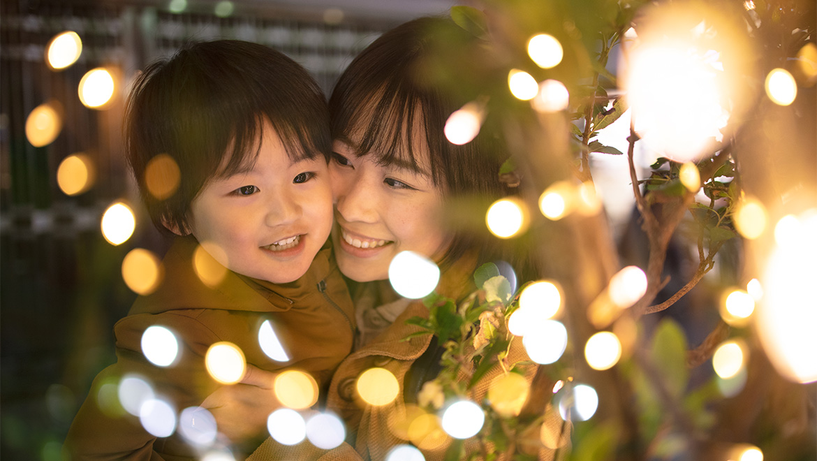 woman with child looking at lights