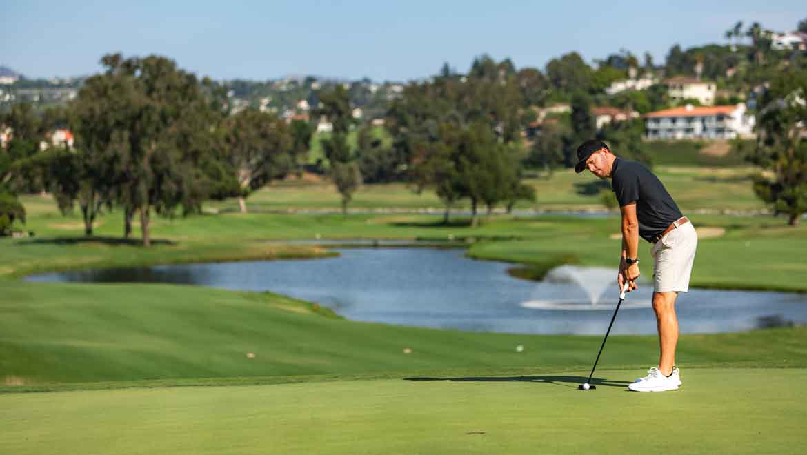 Man putting a golf ball. 