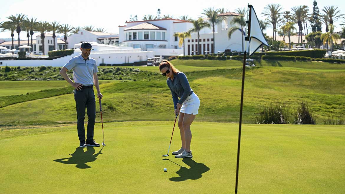 Couple playing golf